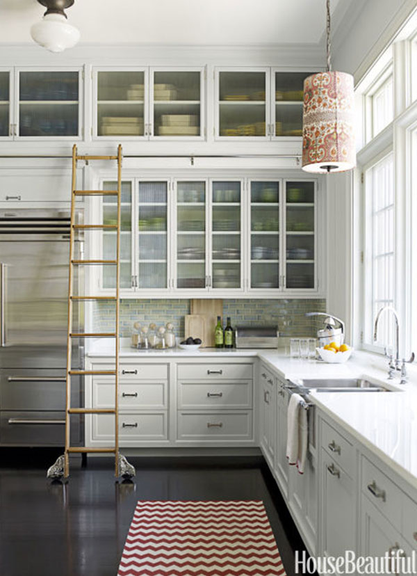 ladders make ceiling-tall cabinets easy to reach