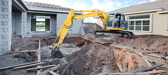 excavator removing inground pool