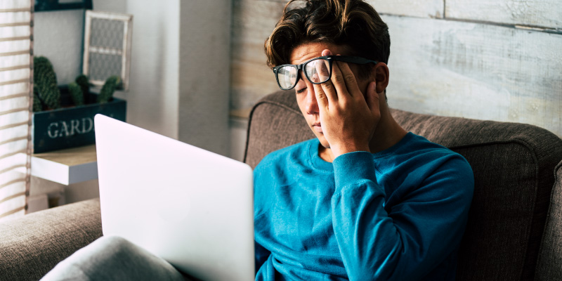 man looking stressed in home