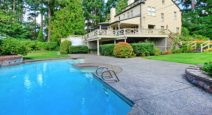 inground pool in house backyard