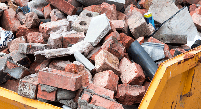 dumpster full of broken bricks