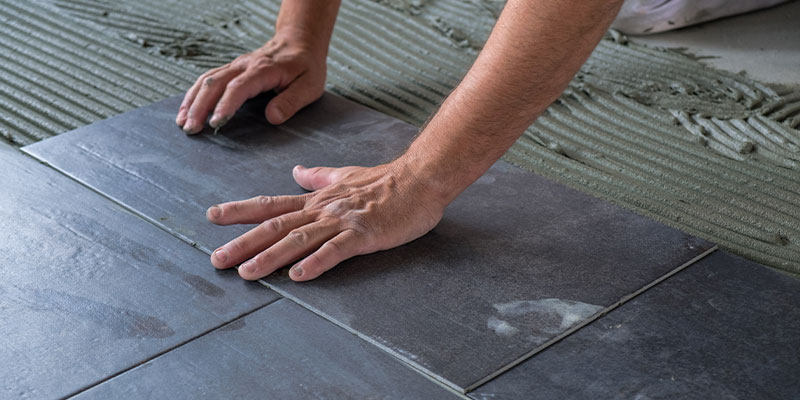 installing floor tiles