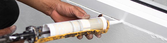 sealing window with caulk