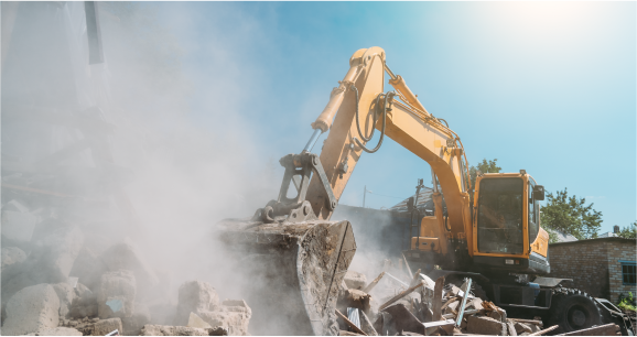 excavator tearing down house