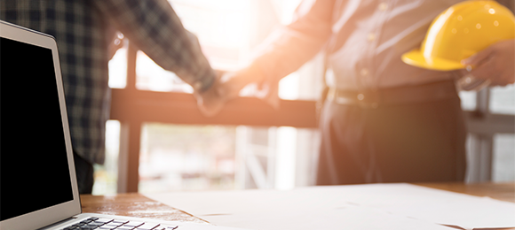 contractor and customer shaking hands