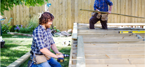 two person crew installing new wood deck